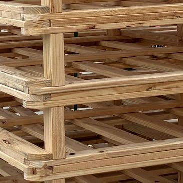 Stacked wooden frames with a lattice design.