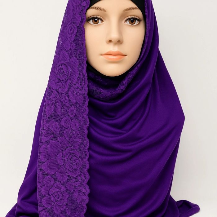 Mannequin wearing deep purple hijab with floral lace on one side, white background.