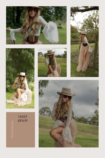 A stylish woman in a wide-brimmed hat and flowing dress poses outdoors in nature.