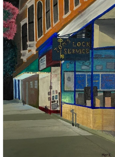 A nighttime scene of the front of Tom's Lock Service on downtown 3rd street in Winona, MN.