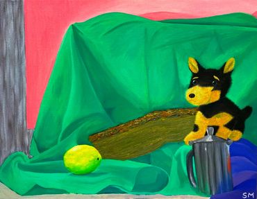 A fuzzy toy dog, lemon, tankard, and piece of wood surrounded by green, pink, and blue fabric.