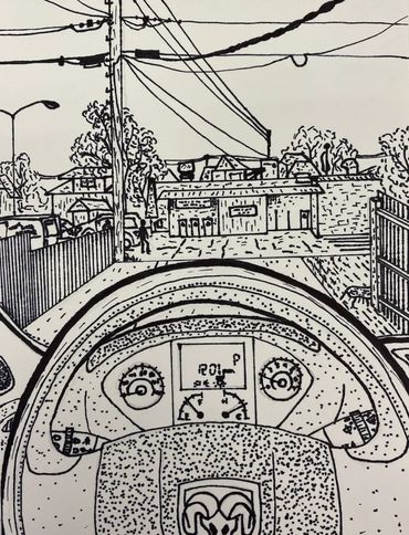 A POV shot sitting inside the drivers seat of the Tom's Lock Van overlooking the alley and driveway.