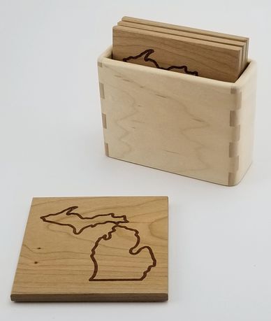 Cherry drink coasters with Michigan outline in hard maple carrier