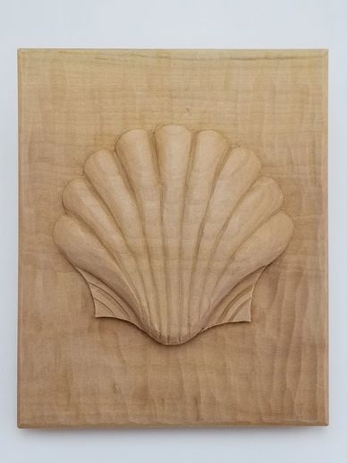 Carved shell in basswood