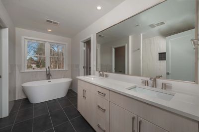 Stunning new bathroom featuring luxurious custom bathtub and modern design