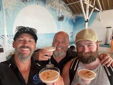 Three person enjoying food at Scuba diving Academy