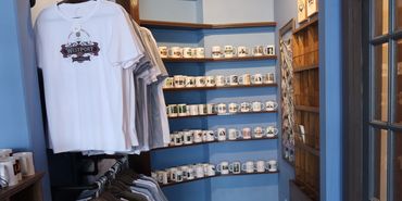 T-shirts and coffee mugs in shop