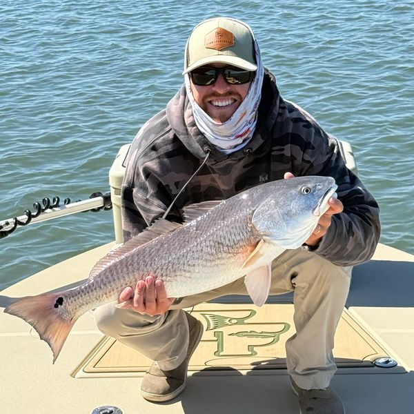 Capt. Michael holding a redfish