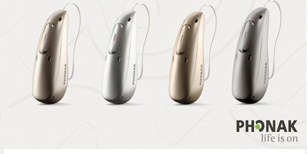Four Phonak behind the ear hearing aids and Phonak logo.