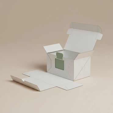 An unfolded and partially assembled white cardboard box on a beige surface.