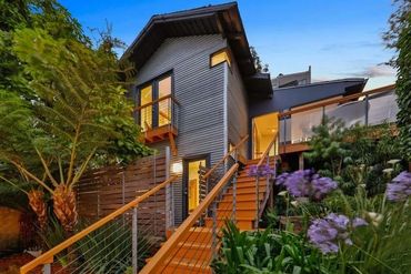Beautifully realized vision from a humble ADU cottage on a hill .
