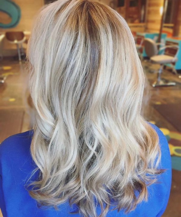 Blonde highlights with a root shading technique.