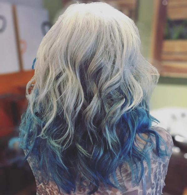 Natural grey hair with long layers and direct blue dye