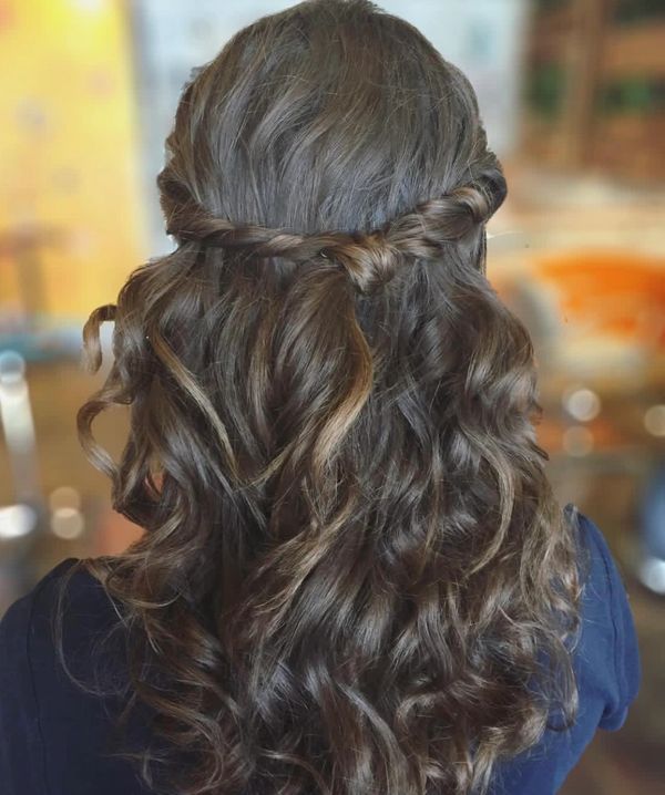 Event hair styled with half up and loose waves.