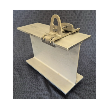 Metal clamp holding a steel I-beam against a textured background.