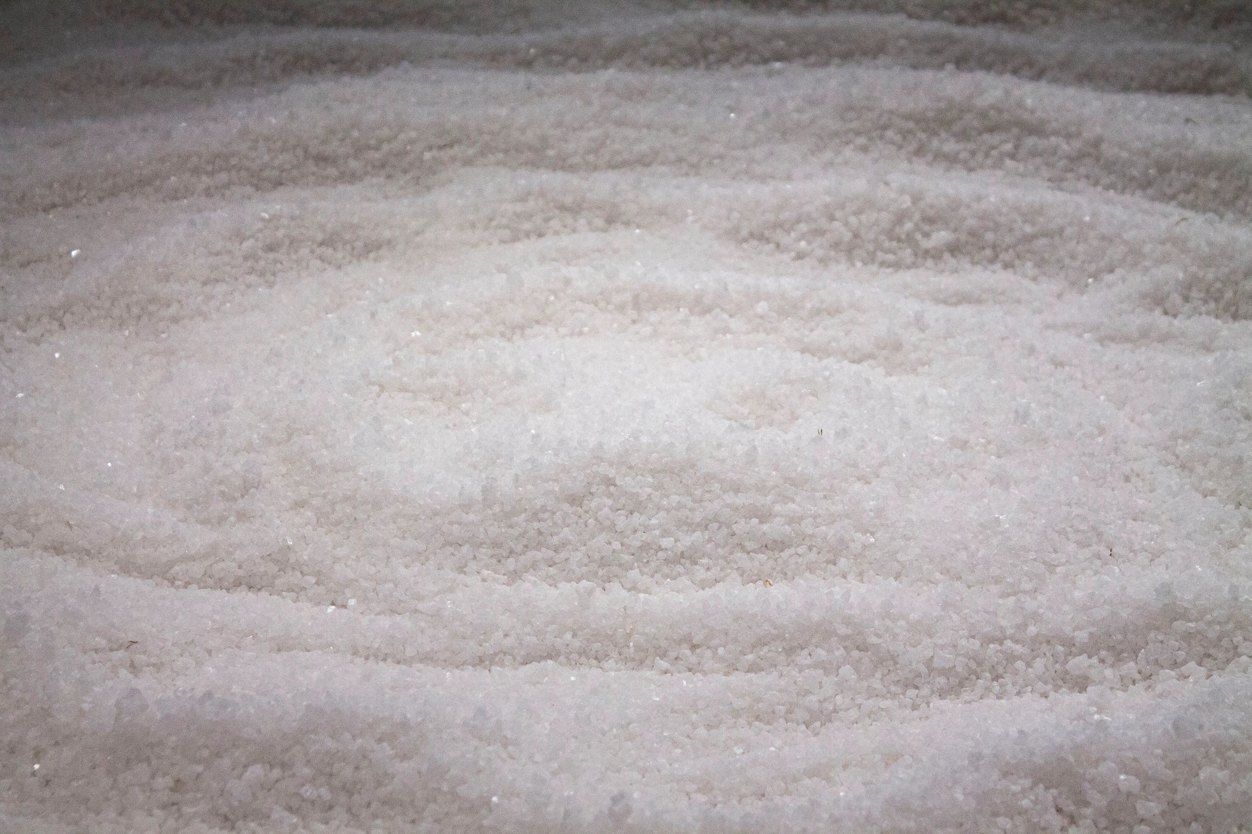 Photograph of a large pile salt crystals with circular shapes drawn into it.