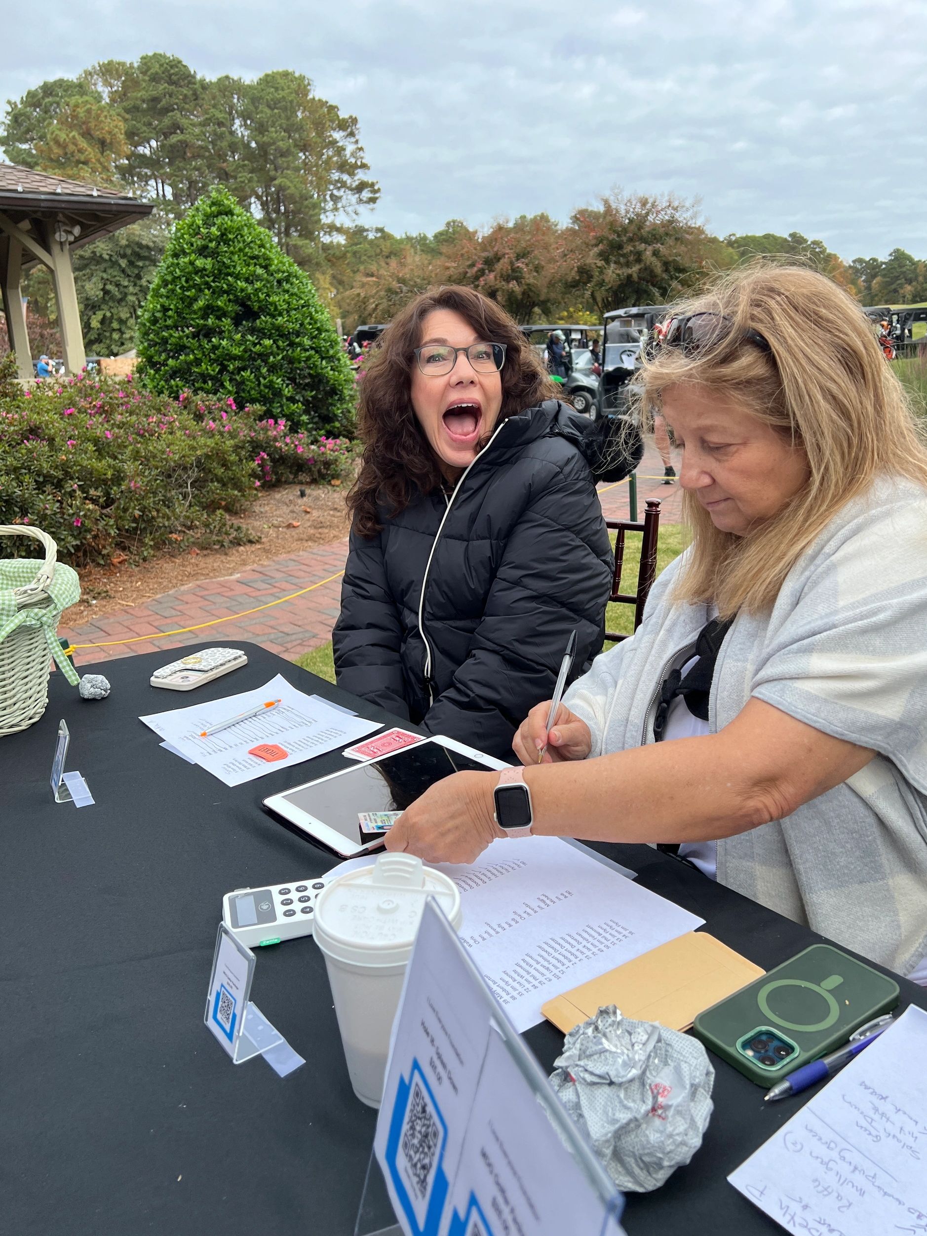 I Love Everyone Volunteers registering players at our annual golf charity