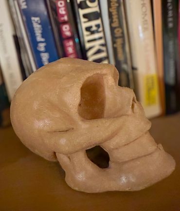 brown clay skull sculpture