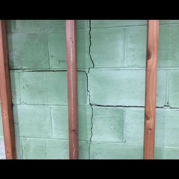 Block walls cracking and shearing.