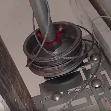 A broken garage door cable or wire