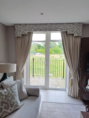 Twin pleated curtains with pelmet