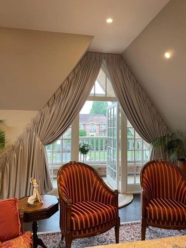 Show home Bespoke curtains fitted into Apex leading to balcony