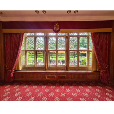 Hotel Drawing Room Bespoke design curtains with tie backs and pelmet and crest