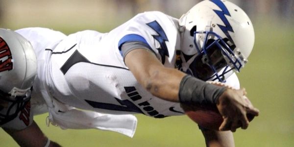 picture of a football player scoring a touchdown