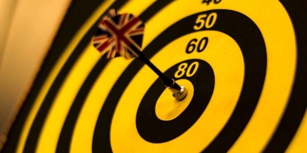 Picture of a dart in the bullseye of a dartboard.