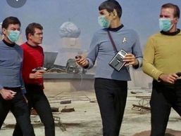 Original Star Trek cast wearing masks. except one guy- an extra .