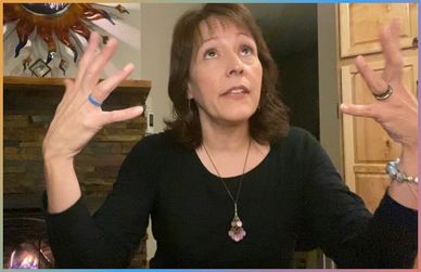 Maria-Lupita is looking upward with her hands up, guiding through life events.