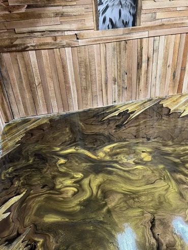 Mixed Media concrete overlay and metallic epoxy floor