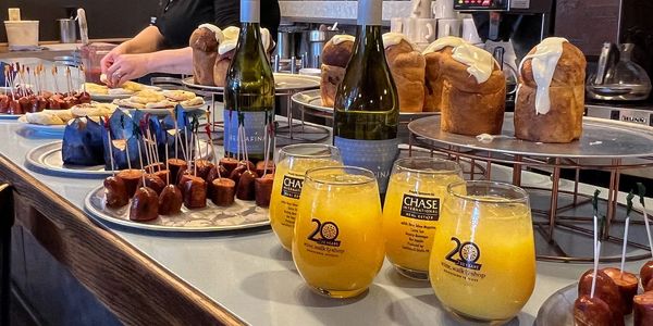 Mimosas, pastries and food items line the bar