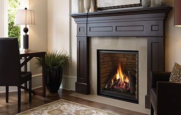 a nice gas burning fireplace installed in a living room