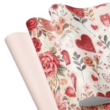 Artful wrapping paper in romantic pink and red florals and heart-inspired patterns.