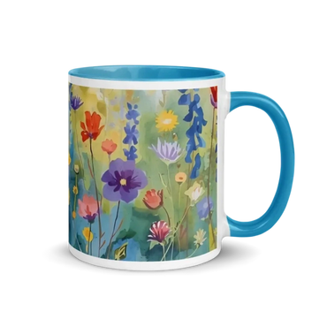 Watercolor floral design on a coffee mug with a teal blue handle, and teal color inside the mug.