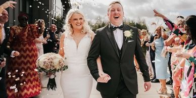 Young couple confettii shot after celebrant wedding.
Image by @adamjoerobertsphotography