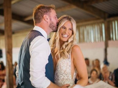 couple during celebrant wedding ceremony in a barn. By Nicola Campbell Photography