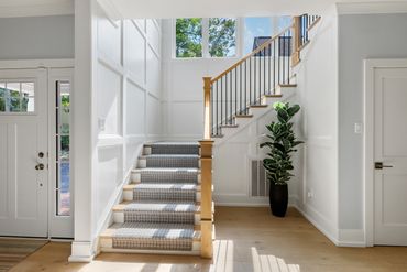 Custom millwork, staircase, and runner