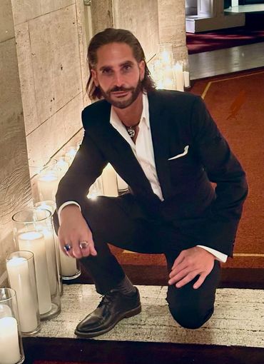 Jared Ruban posing in his suit.