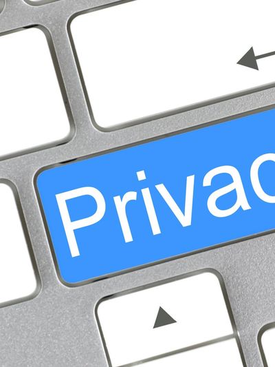 Keyboard with a blue key labeled 'Privacy' symbolizing data protection.