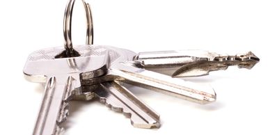 A set of mechanical keys on a key ring.