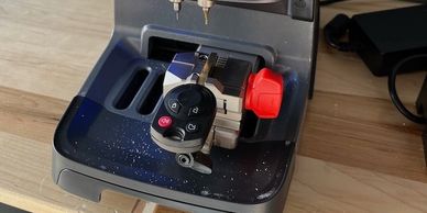 Machine cutting a new smart prox key