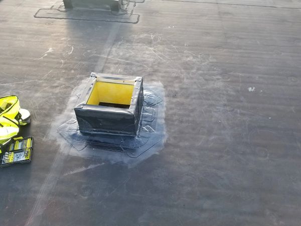 Hole cut in roof, curb built and water-proofed for A.C. unit.