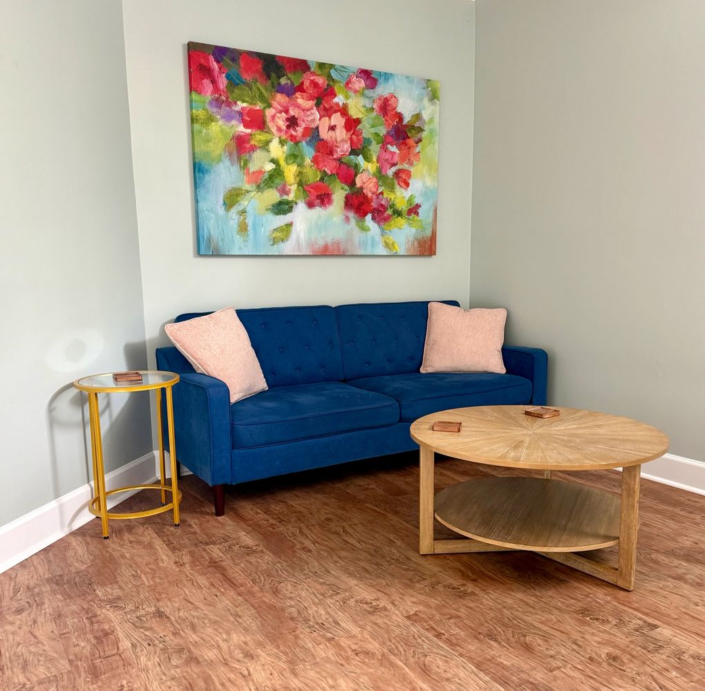 Waiting area with couch and tables