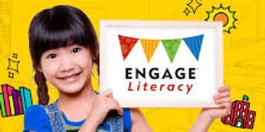 Smiling girl holding Engage Literacy banner.