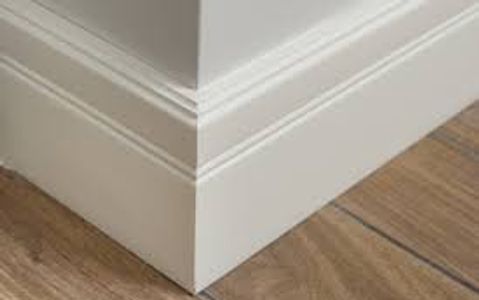 finish carpentry work. interior base trim installation