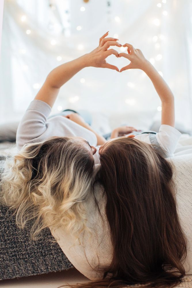 A happy mom and daughter showing love to each other.