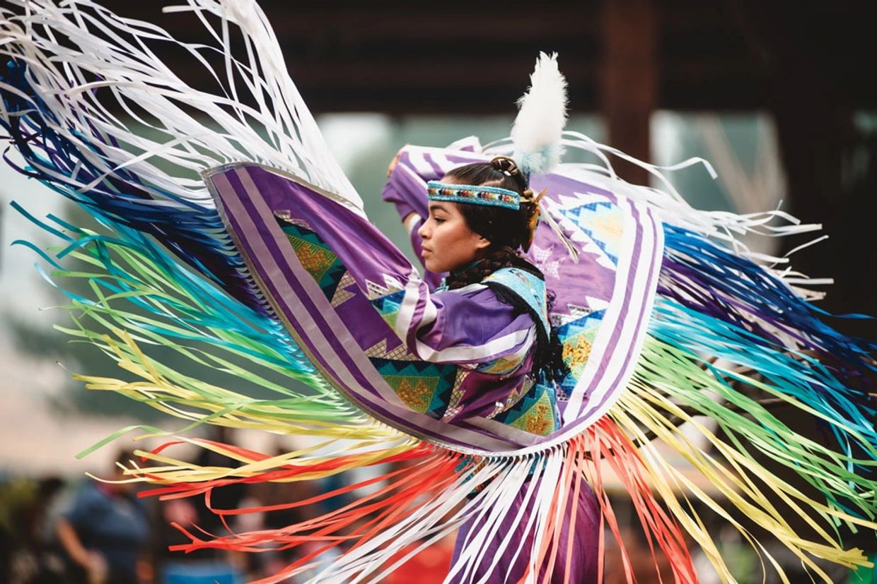 Traditional native grass dancer dancing.