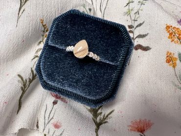 Breast milk ring with baby hair and pearl dust